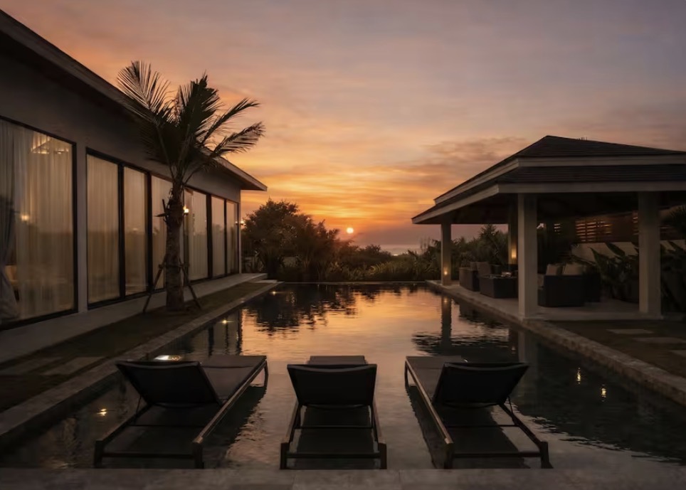 VIP luxury villa at sunset with loungers by the pool